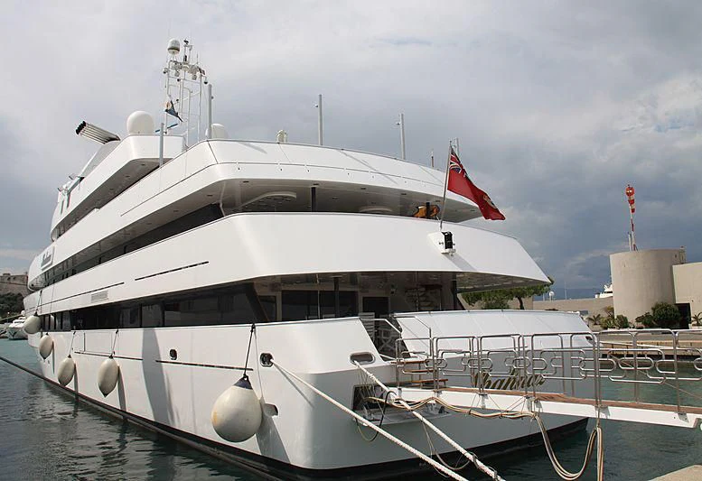 a large white boat with flags on it aboard SHAHNAZ Yacht for Sale