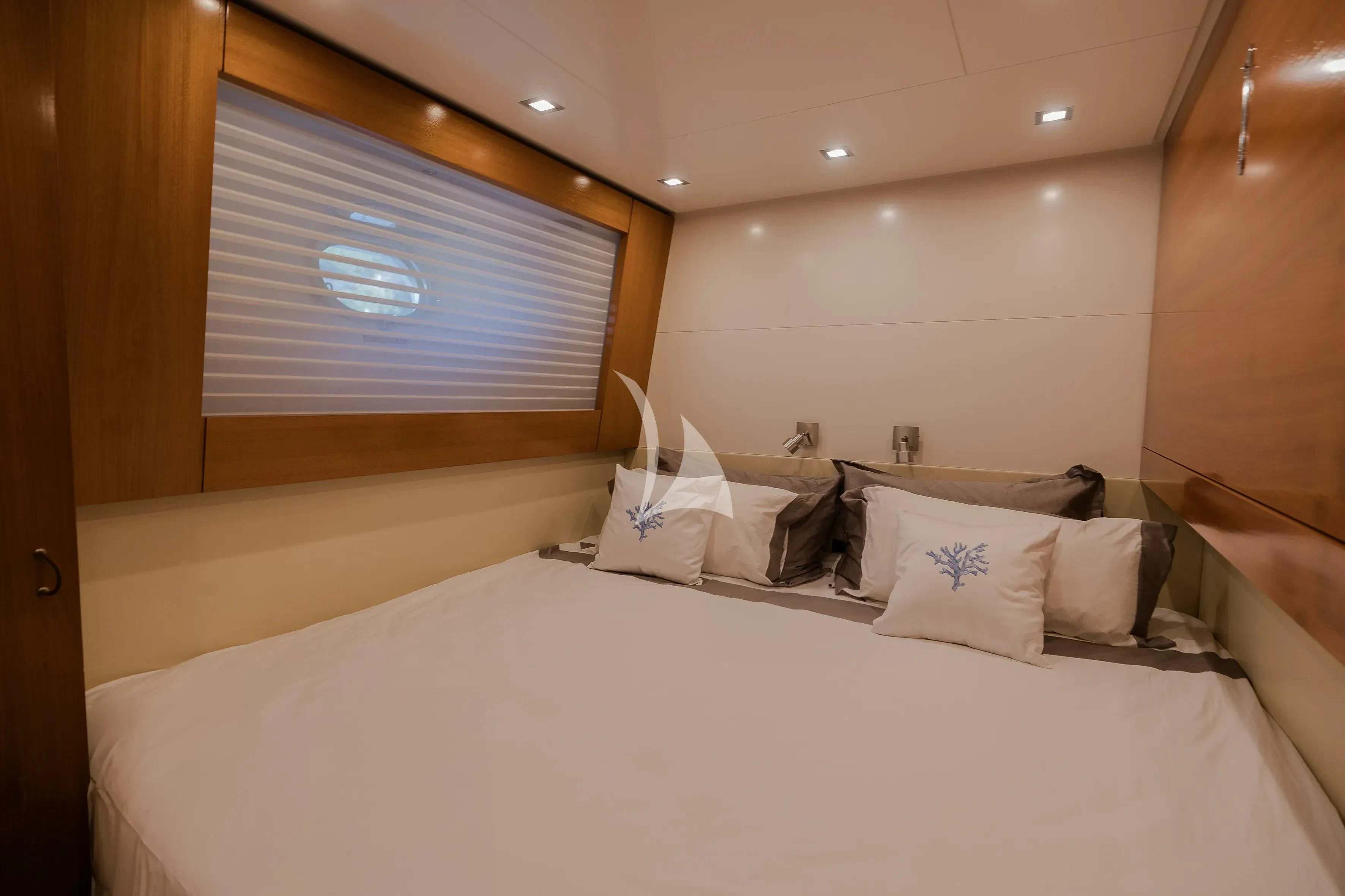 a bed with white sheets aboard OCEAN DELTA 11 Yacht for Sale