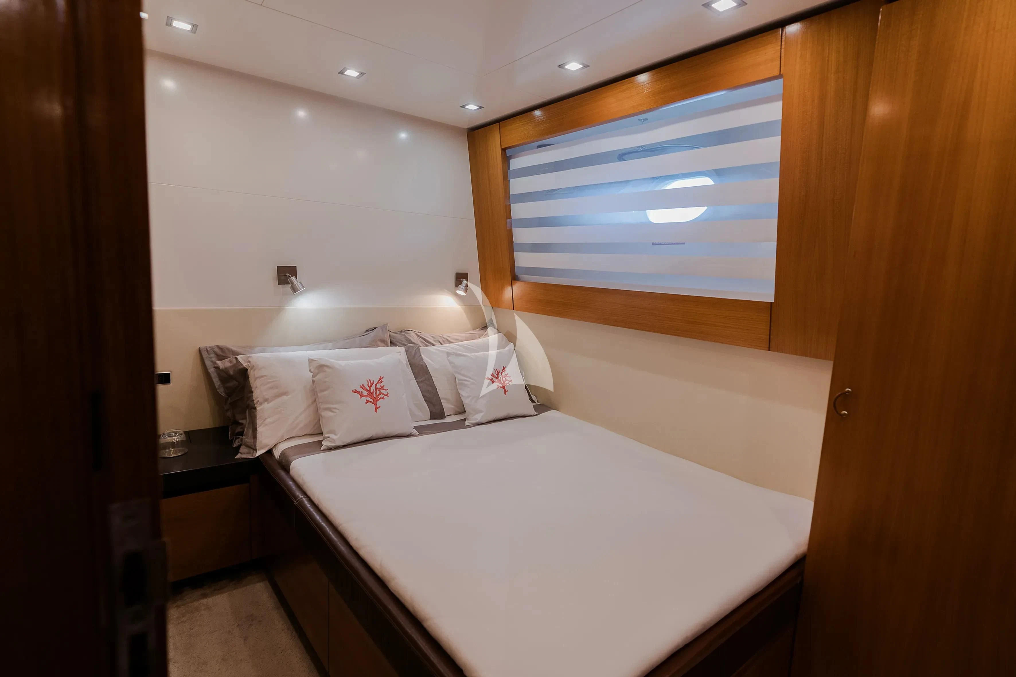 a room with a bed and a window aboard OCEAN DELTA 11 Yacht for Sale