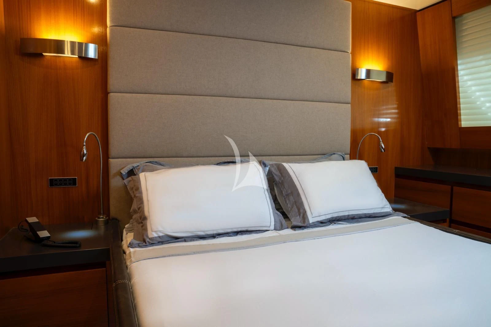 a bed with white pillows aboard OCEAN DELTA 11 Yacht for Sale