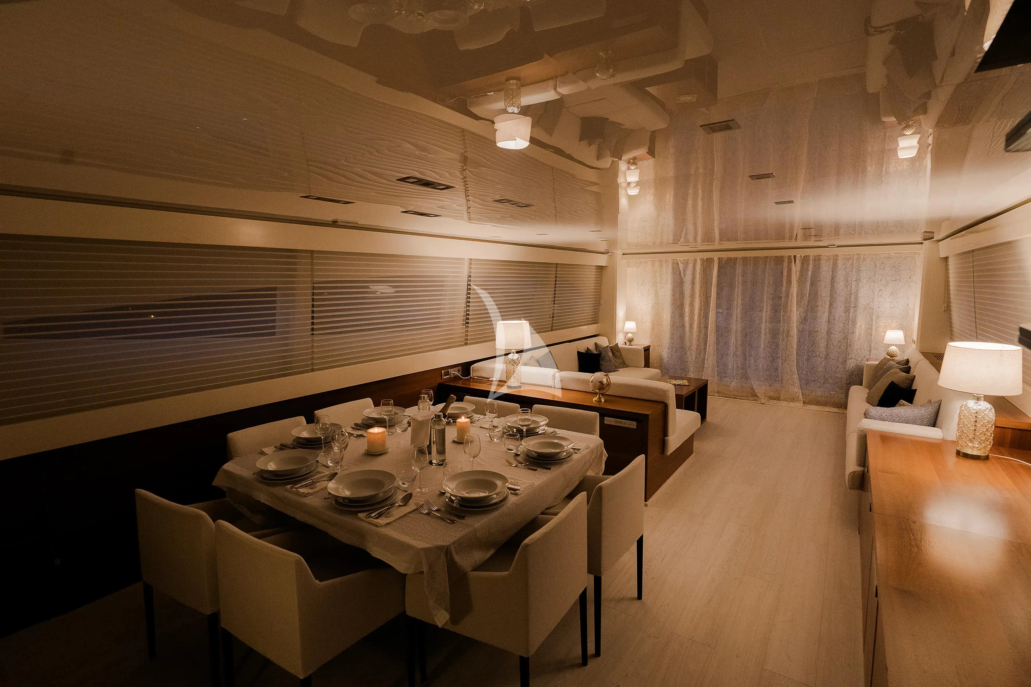 a room with a table and chairs aboard OCEAN DELTA 11 Yacht for Sale