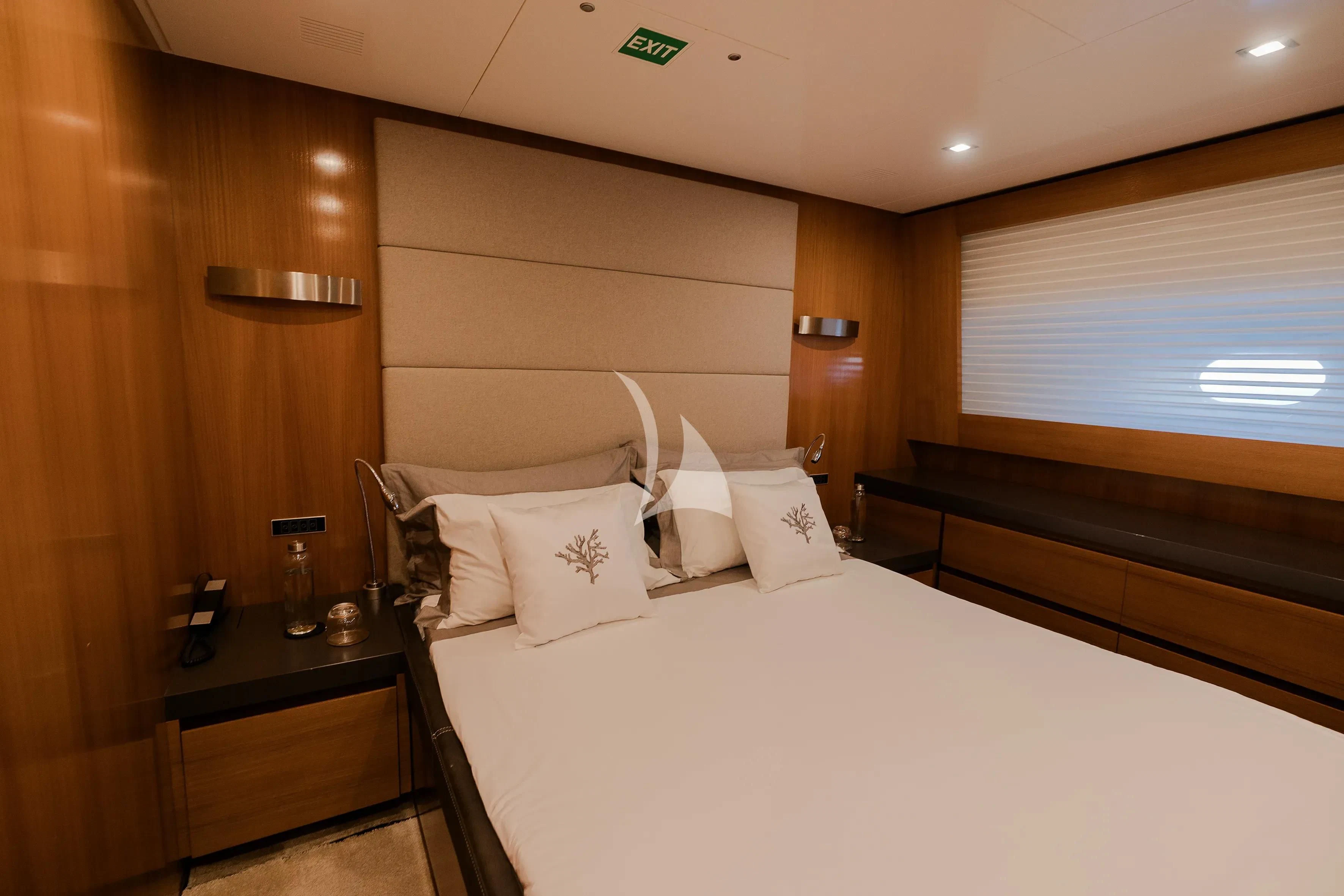 a bed with white sheets aboard OCEAN DELTA 11 Yacht for Sale