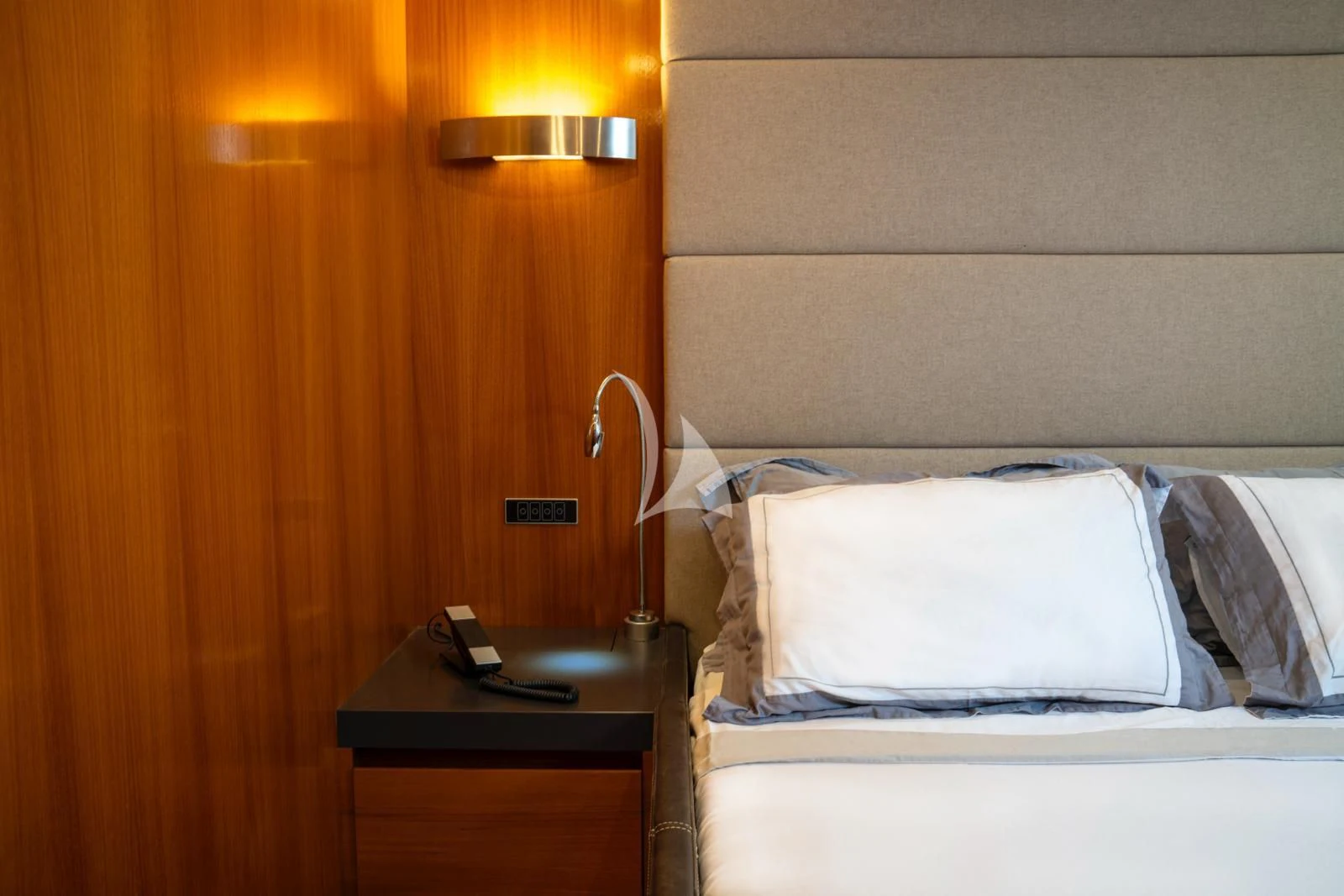 a bed with a phone on it aboard OCEAN DELTA 11 Yacht for Sale