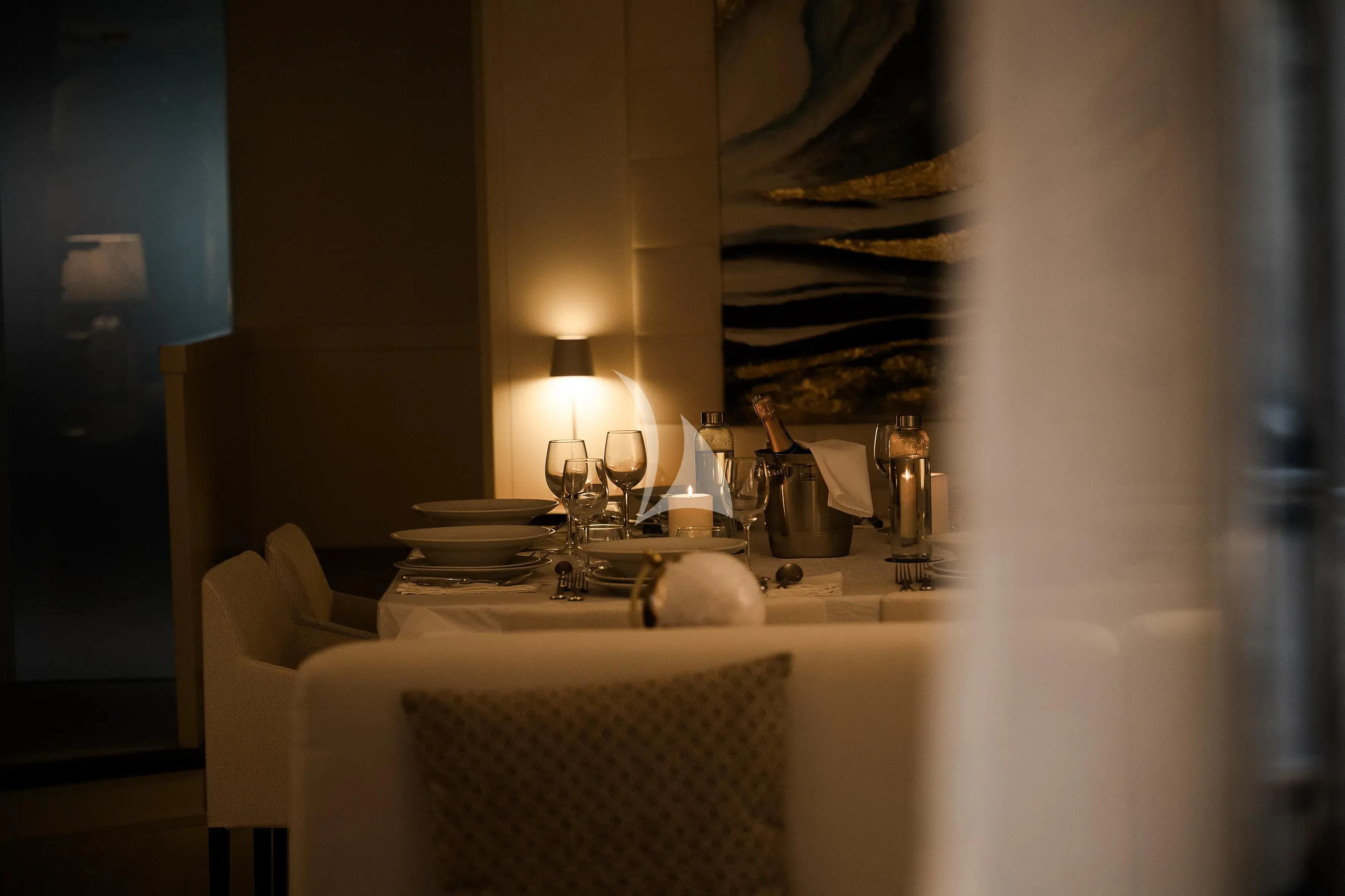 a table with a white cloth draped over it aboard OCEAN DELTA 11 Yacht for Sale