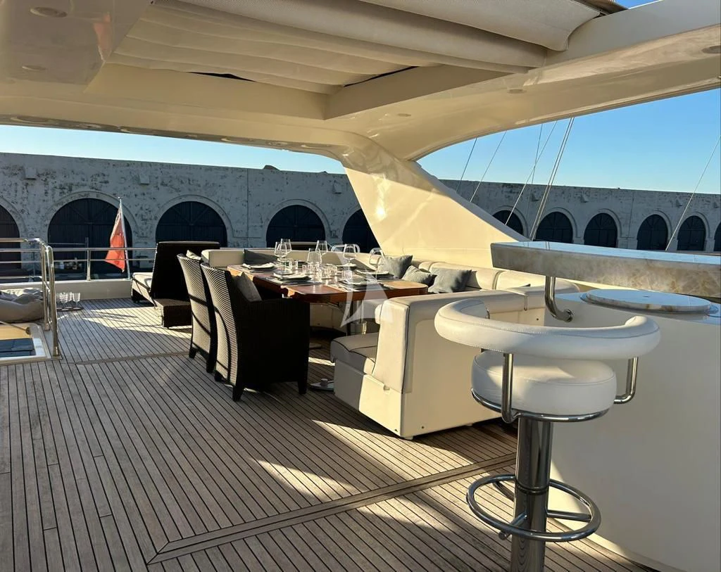 a room with tables and chairs aboard OCEAN DELTA 11 Yacht for Sale