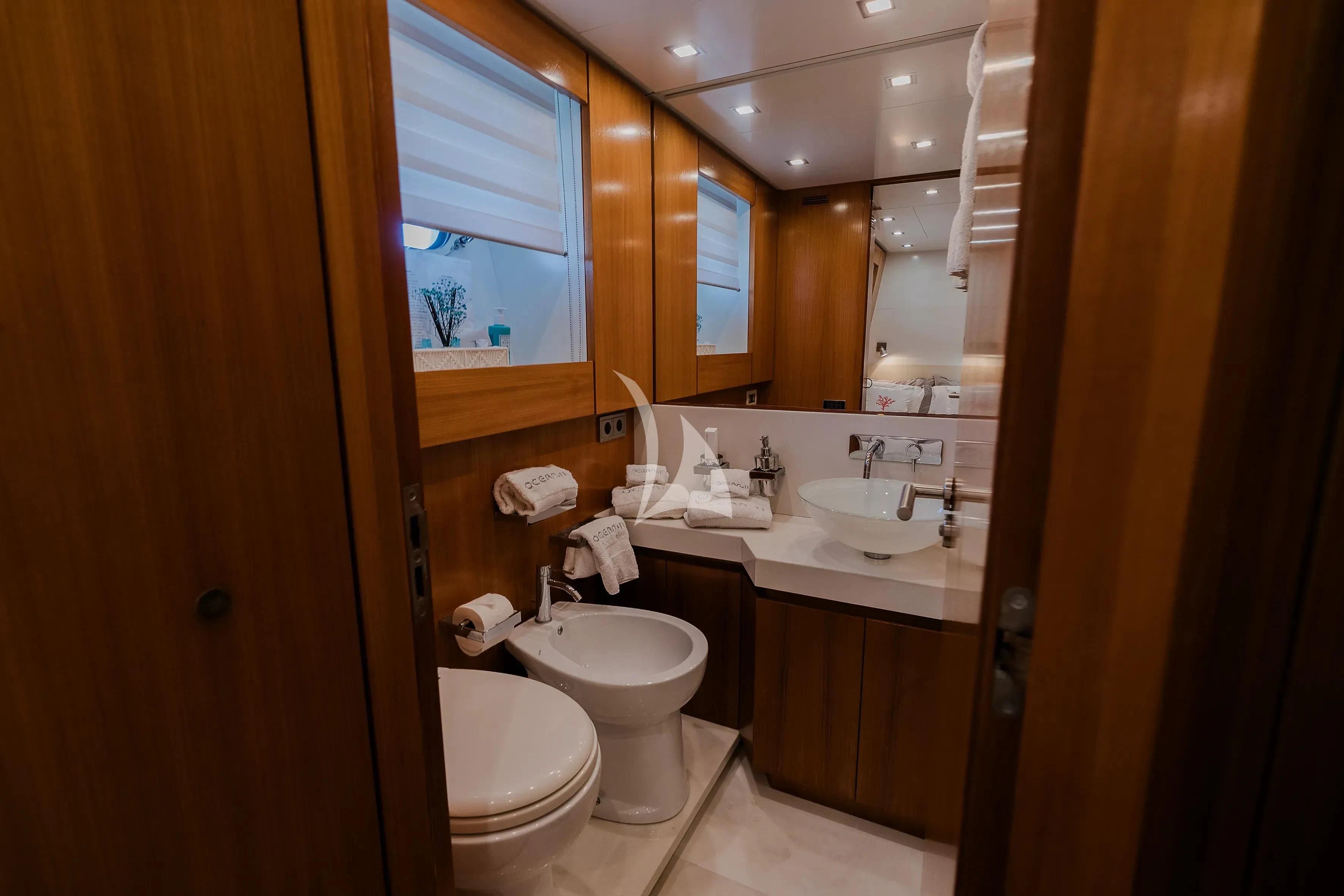 a bathroom with a toilet and sink aboard OCEAN DELTA 11 Yacht for Sale