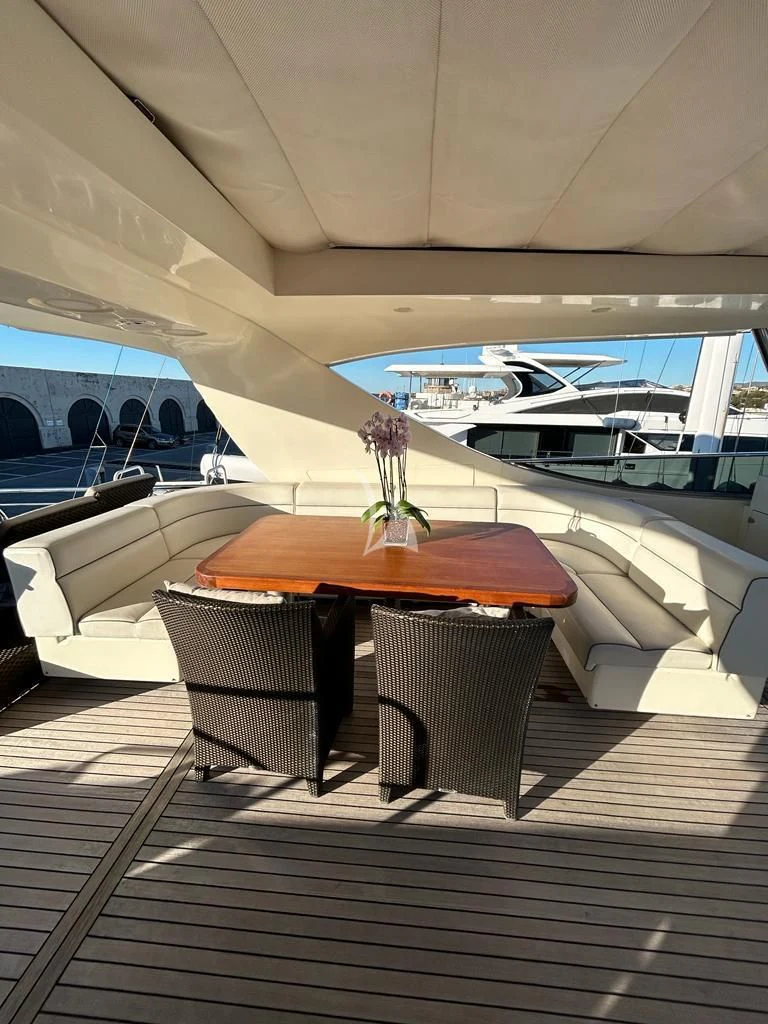 a table and chairs on a boat aboard OCEAN DELTA 11 Yacht for Sale