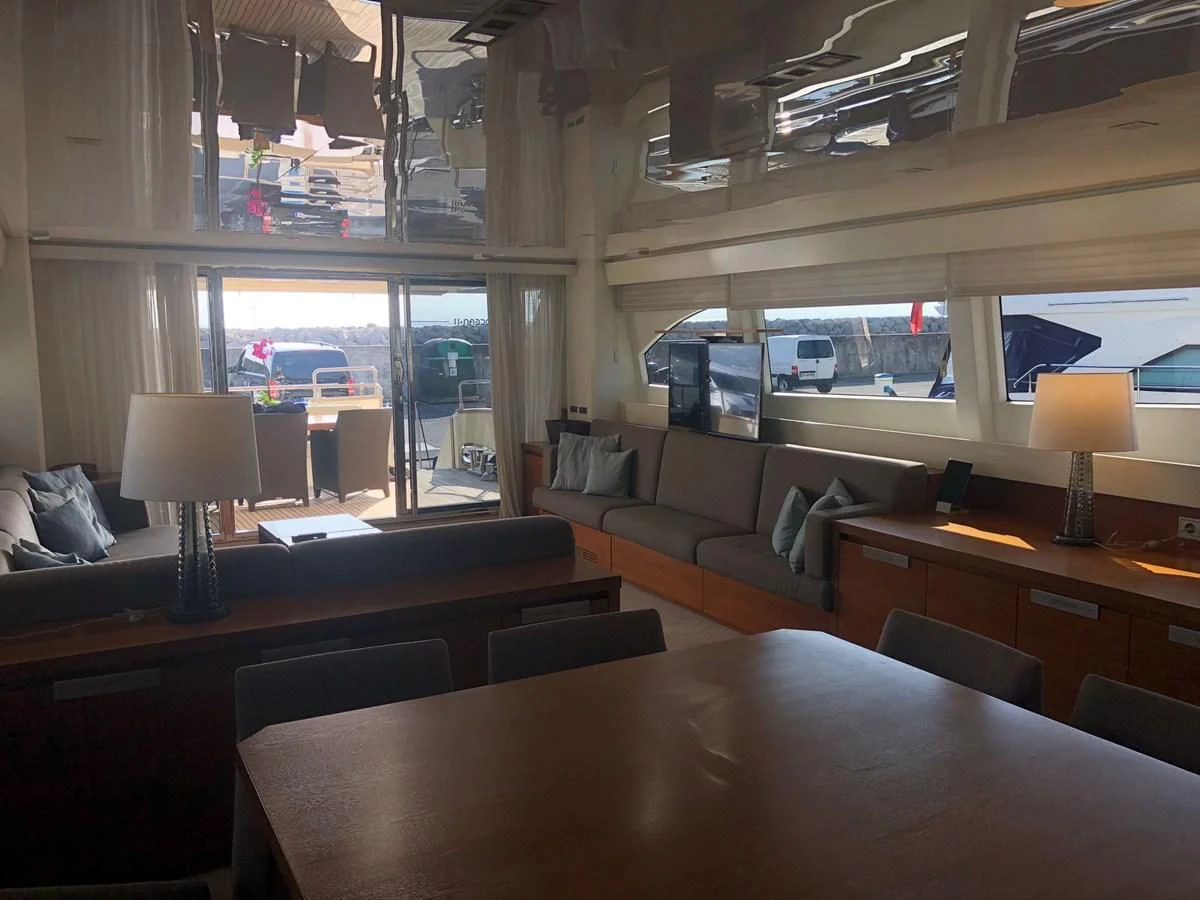 a room with a table and chairs aboard OCEAN DELTA 11 Yacht for Sale