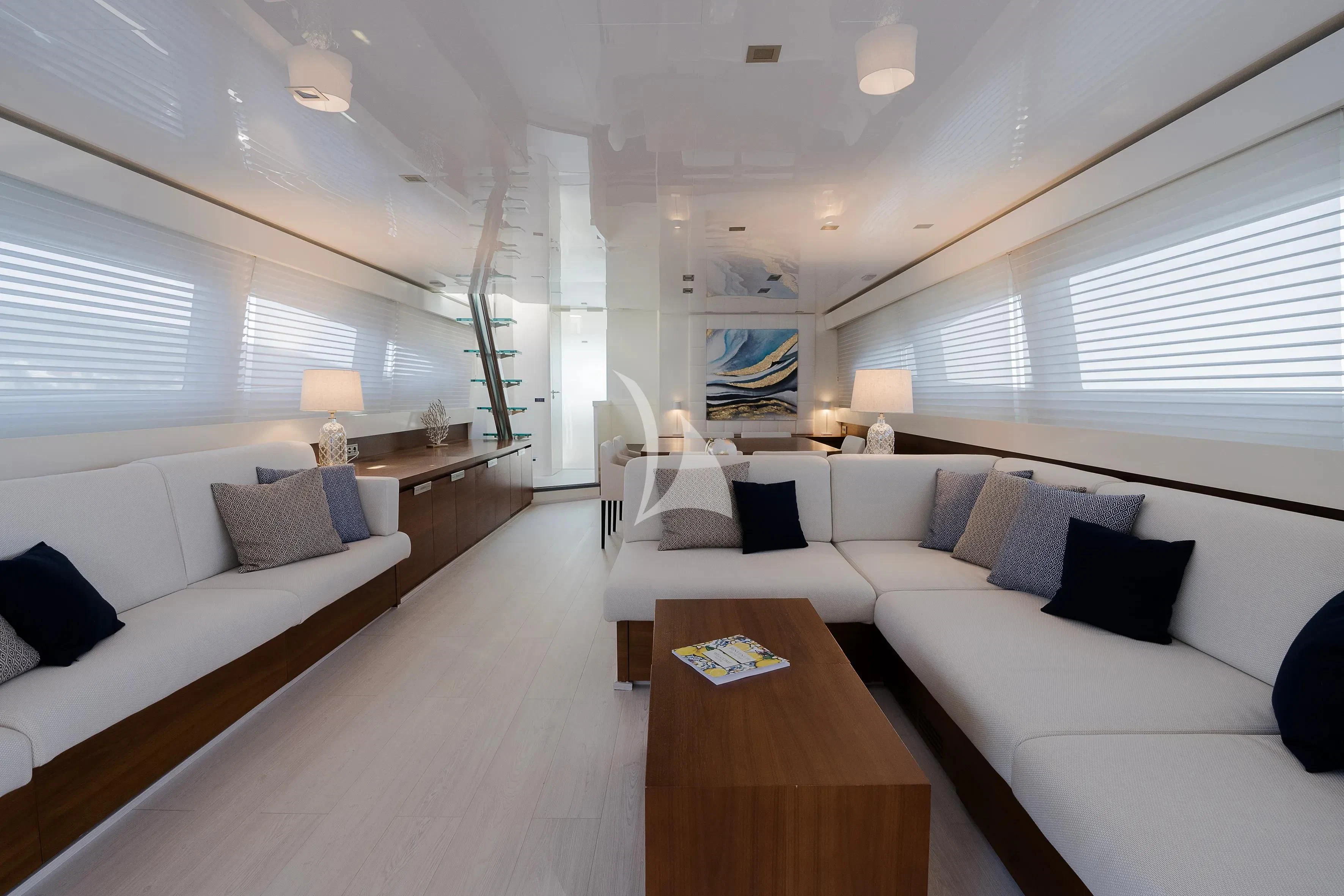 a room with a couch and a table aboard OCEAN DELTA 11 Yacht for Sale