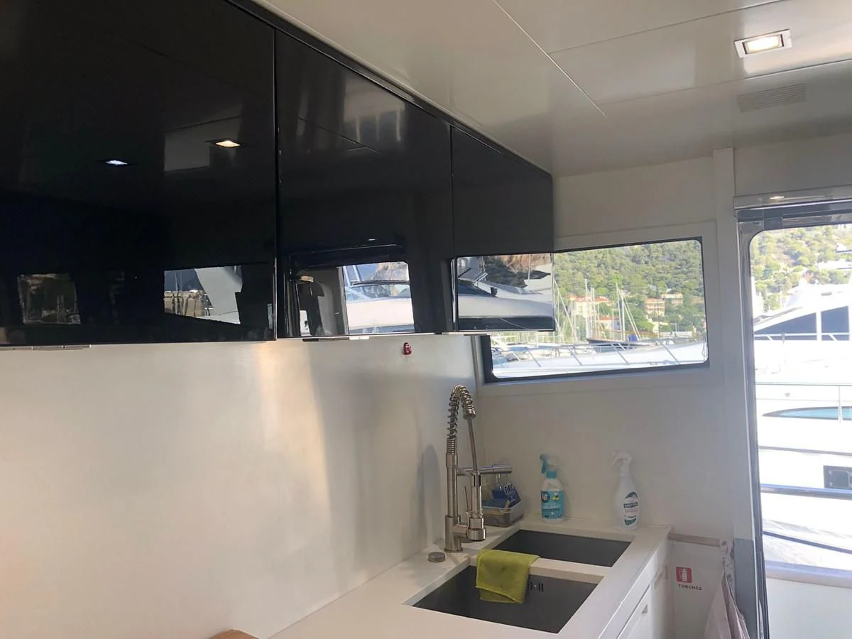 a kitchen with a window aboard OCEAN DELTA 11 Yacht for Sale