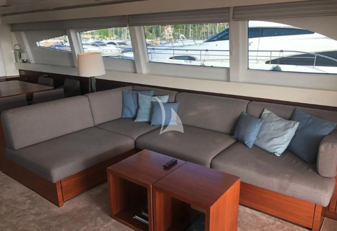 a couch with a table in front of it aboard OCEAN DELTA 11 Yacht for Sale