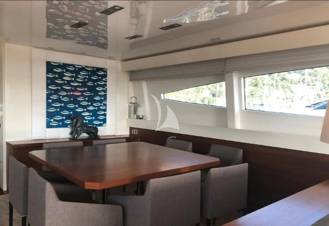 a room with a table and chairs aboard OCEAN DELTA 11 Yacht for Sale