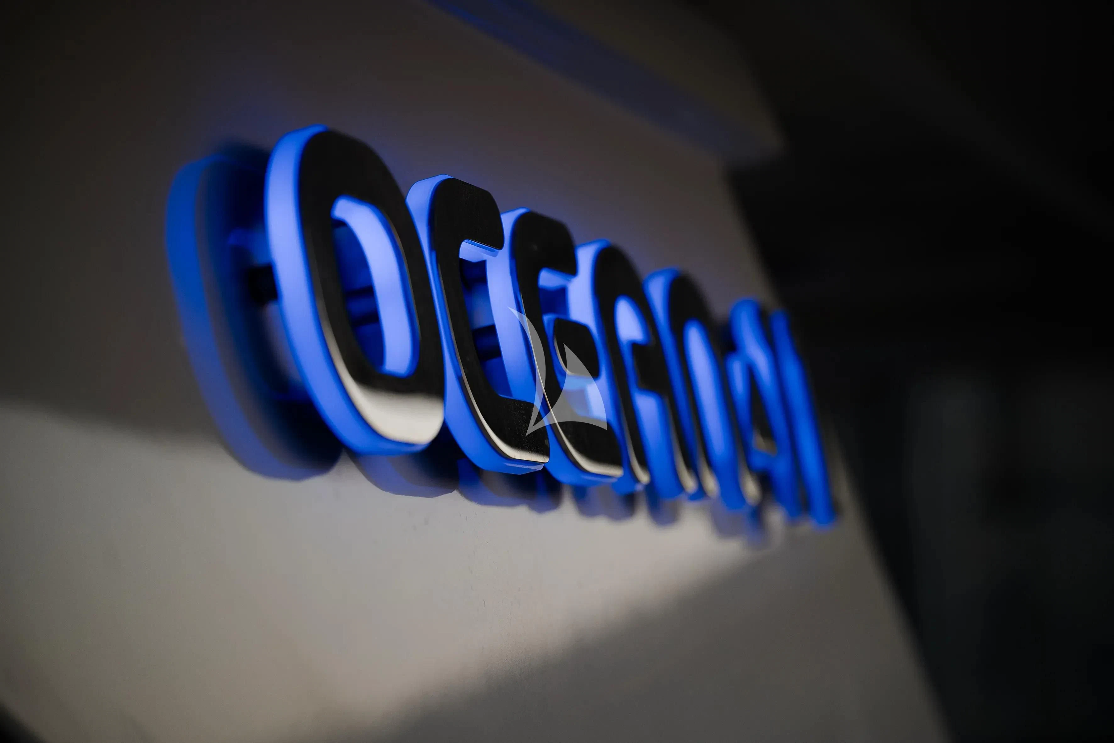 a blue logo on a white surface aboard OCEAN DELTA 11 Yacht for Sale