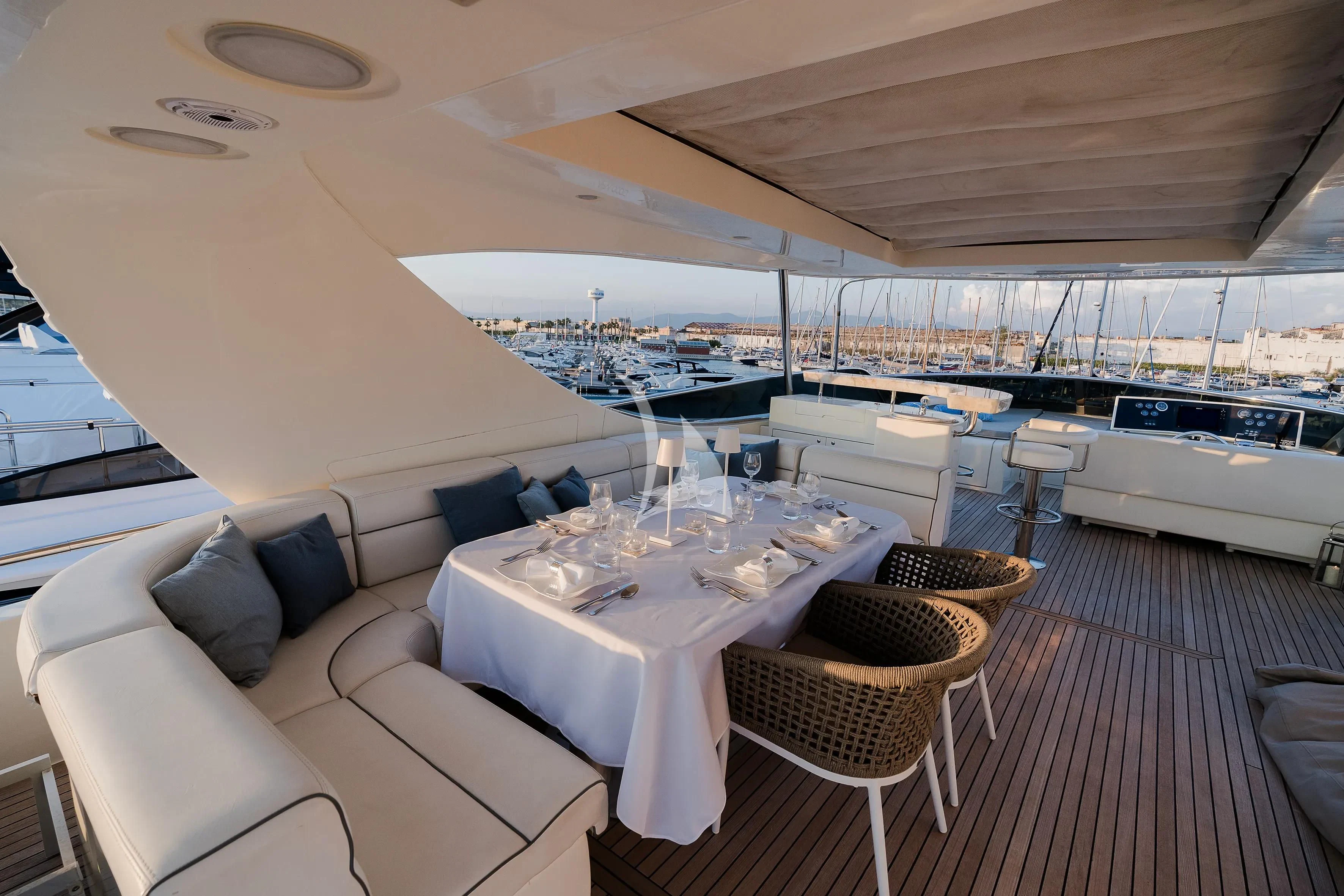 a room with a table and chairs aboard OCEAN DELTA 11 Yacht for Sale