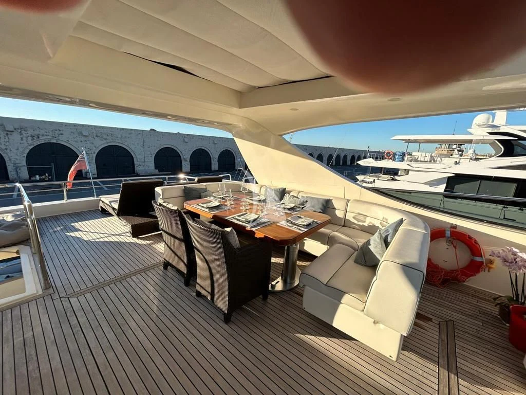 a room with a table and chairs aboard OCEAN DELTA 11 Yacht for Sale