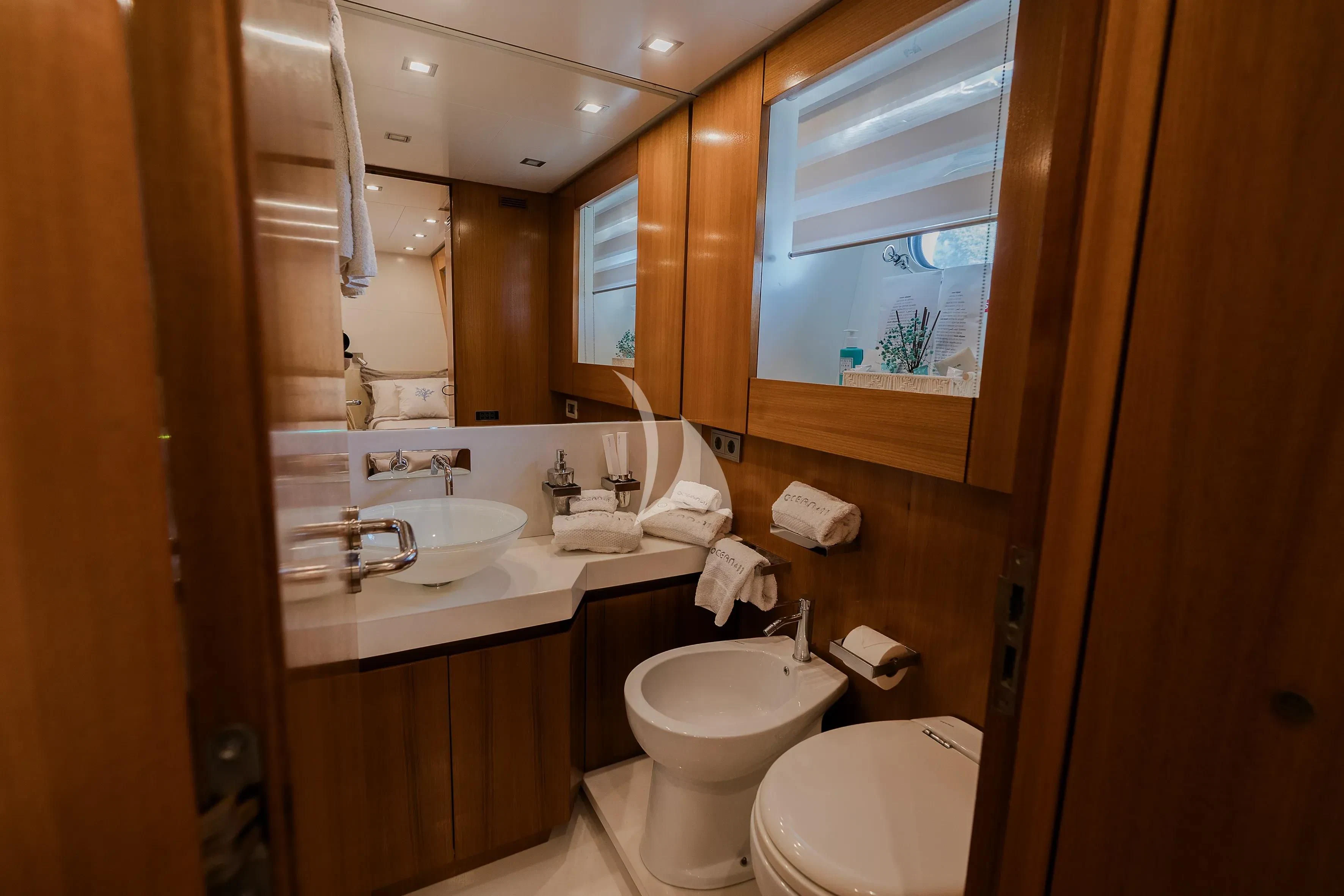 a bathroom with a large mirror aboard OCEAN DELTA 11 Yacht for Sale