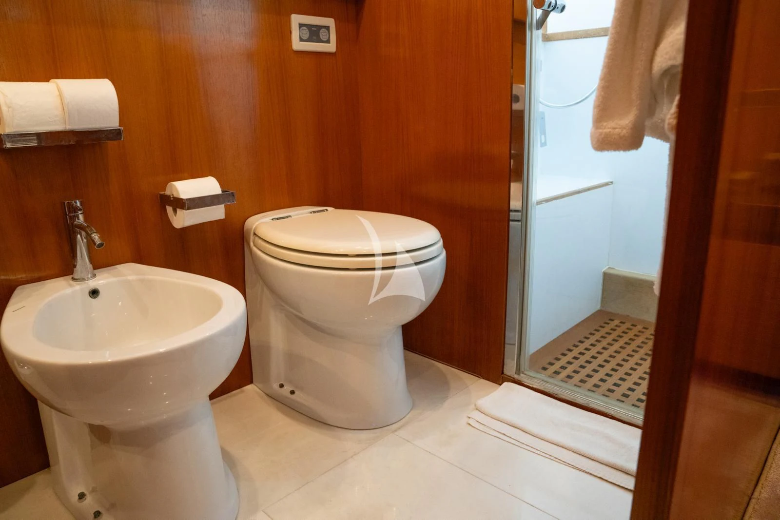 a bathroom with a toilet sink and a mirror aboard OCEAN DELTA 11 Yacht for Sale