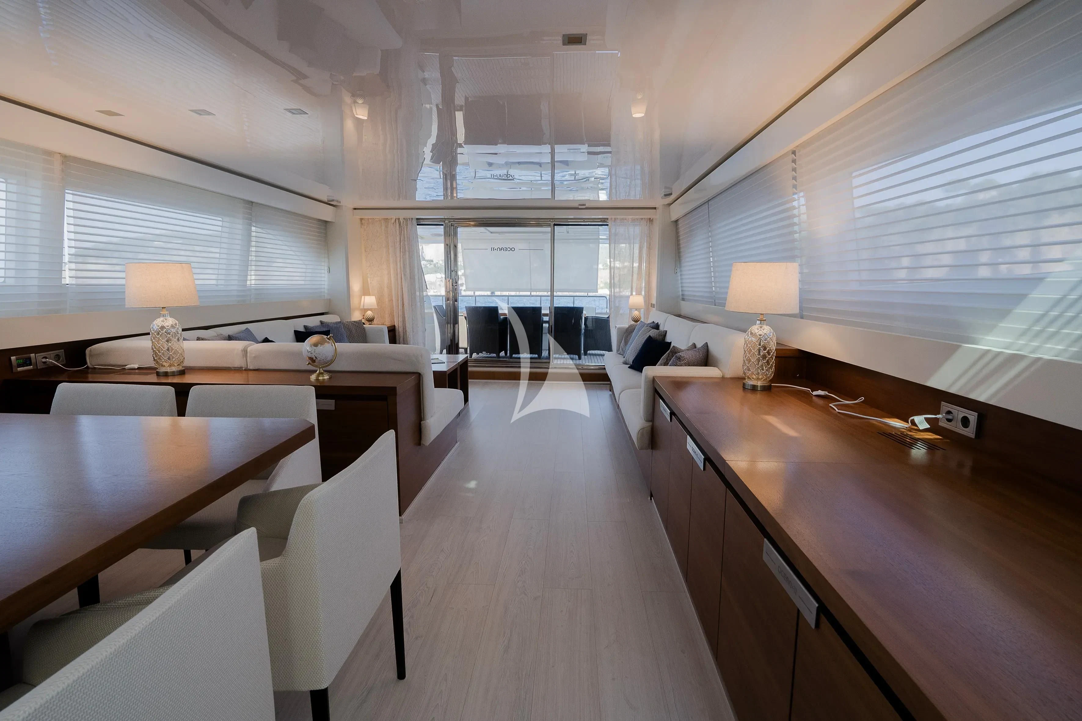 a room with a table chairs and a couch aboard OCEAN DELTA 11 Yacht for Sale