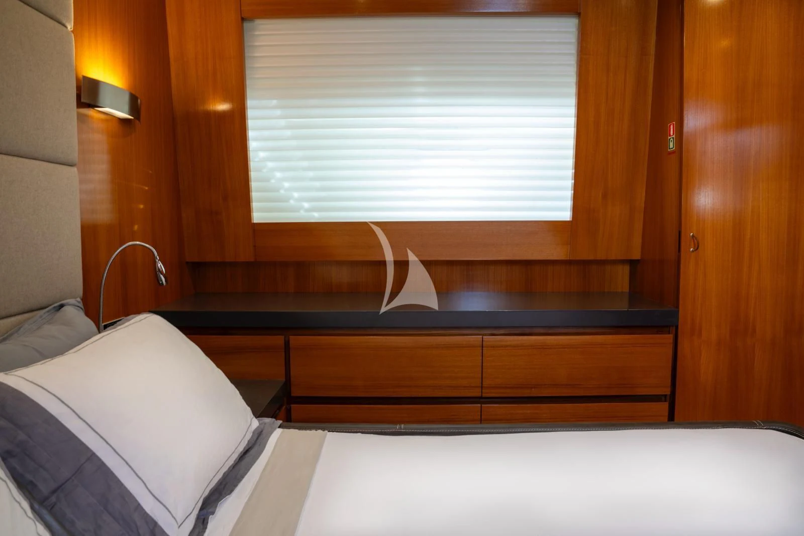 a bed with a lamp and a window aboard OCEAN DELTA 11 Yacht for Sale