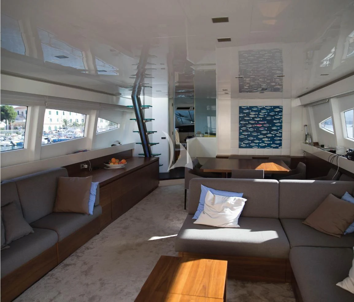 a living room with a couch and a table aboard OCEAN DELTA 11 Yacht for Sale