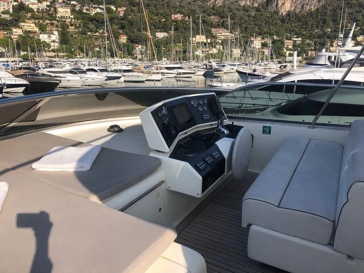 a white car parked in a parking lot with other cars aboard OCEAN DELTA 11 Yacht for Sale