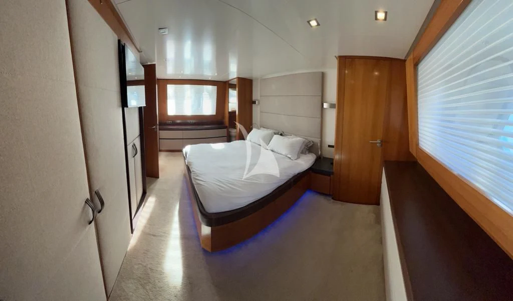 a room with a bed and a door aboard OCEAN DELTA 11 Yacht for Sale