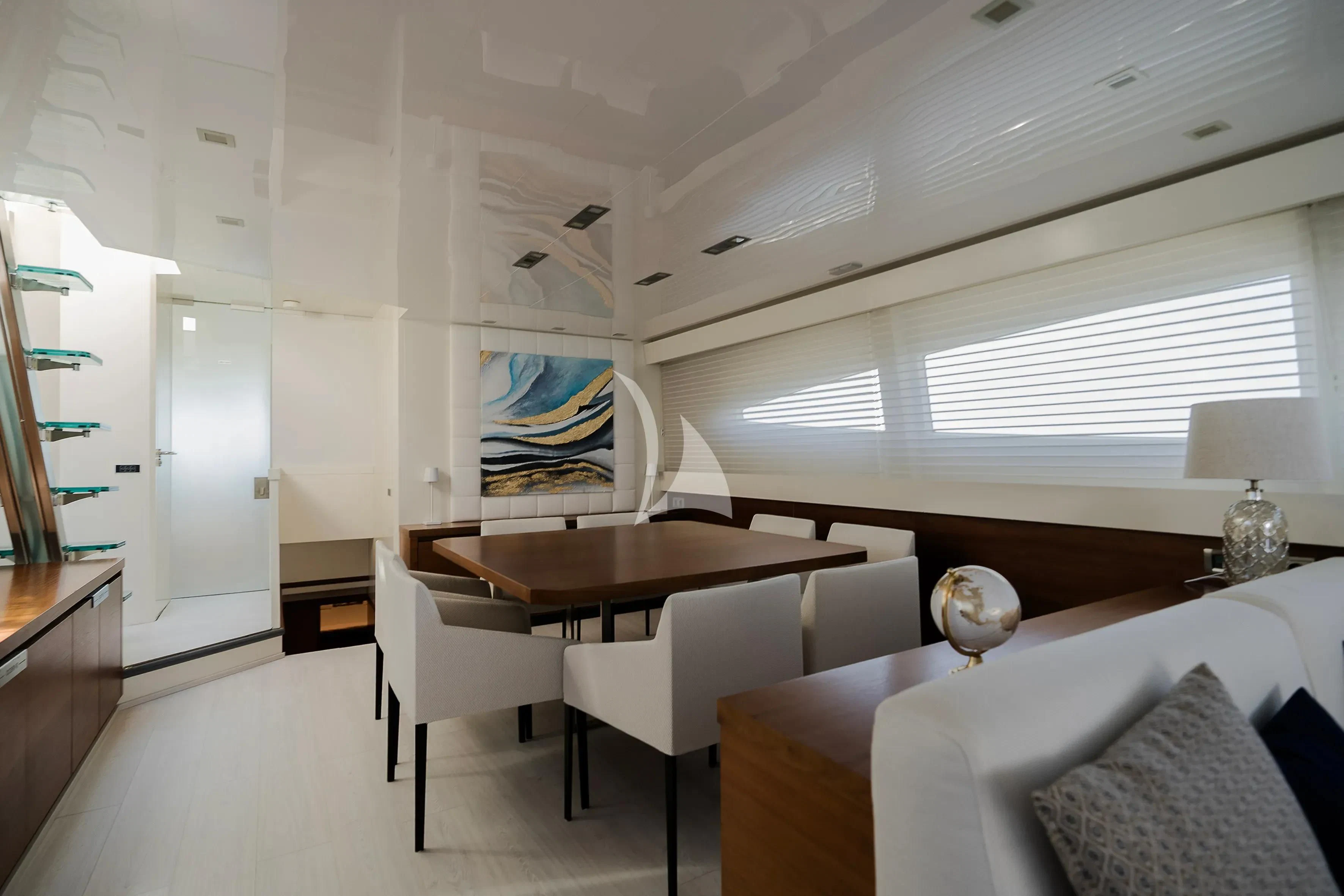 a room with a table and chairs aboard OCEAN DELTA 11 Yacht for Sale
