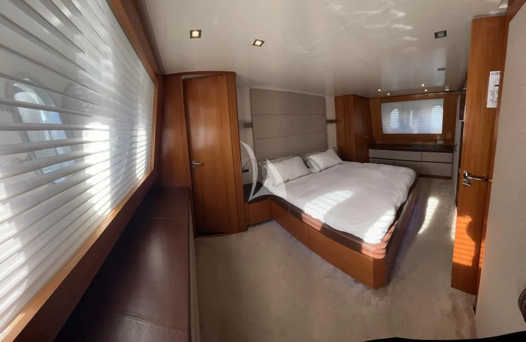 a room with a bed and a closet aboard OCEAN DELTA 11 Yacht for Sale