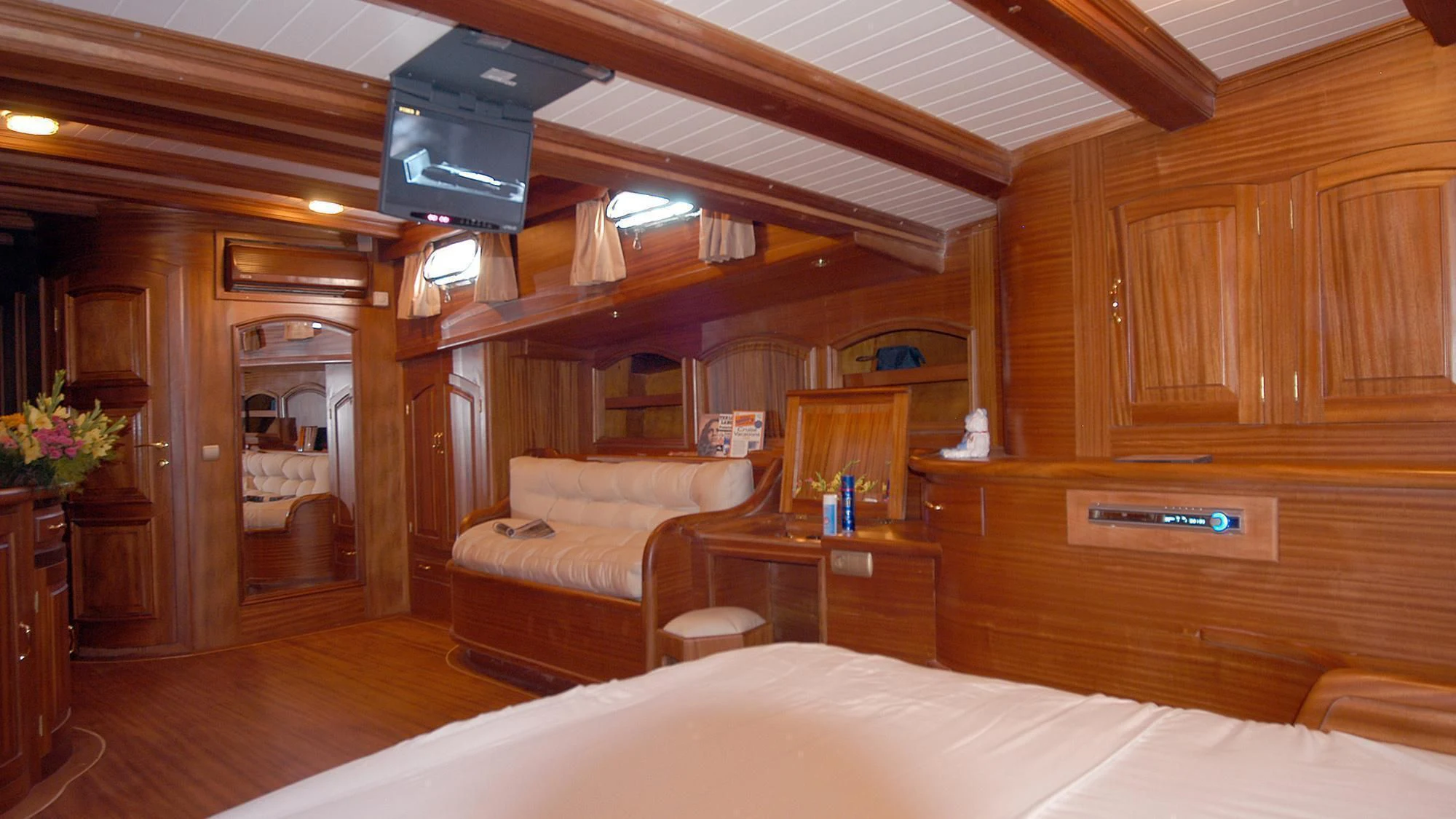 a room with a bed and a desk aboard QUEEN OF KARIA Yacht for Sale