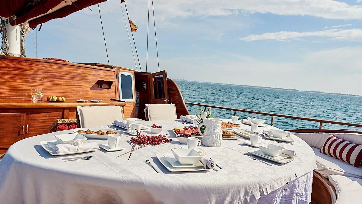a table set for a meal on a boat aboard QUEEN OF KARIA Yacht for Sale