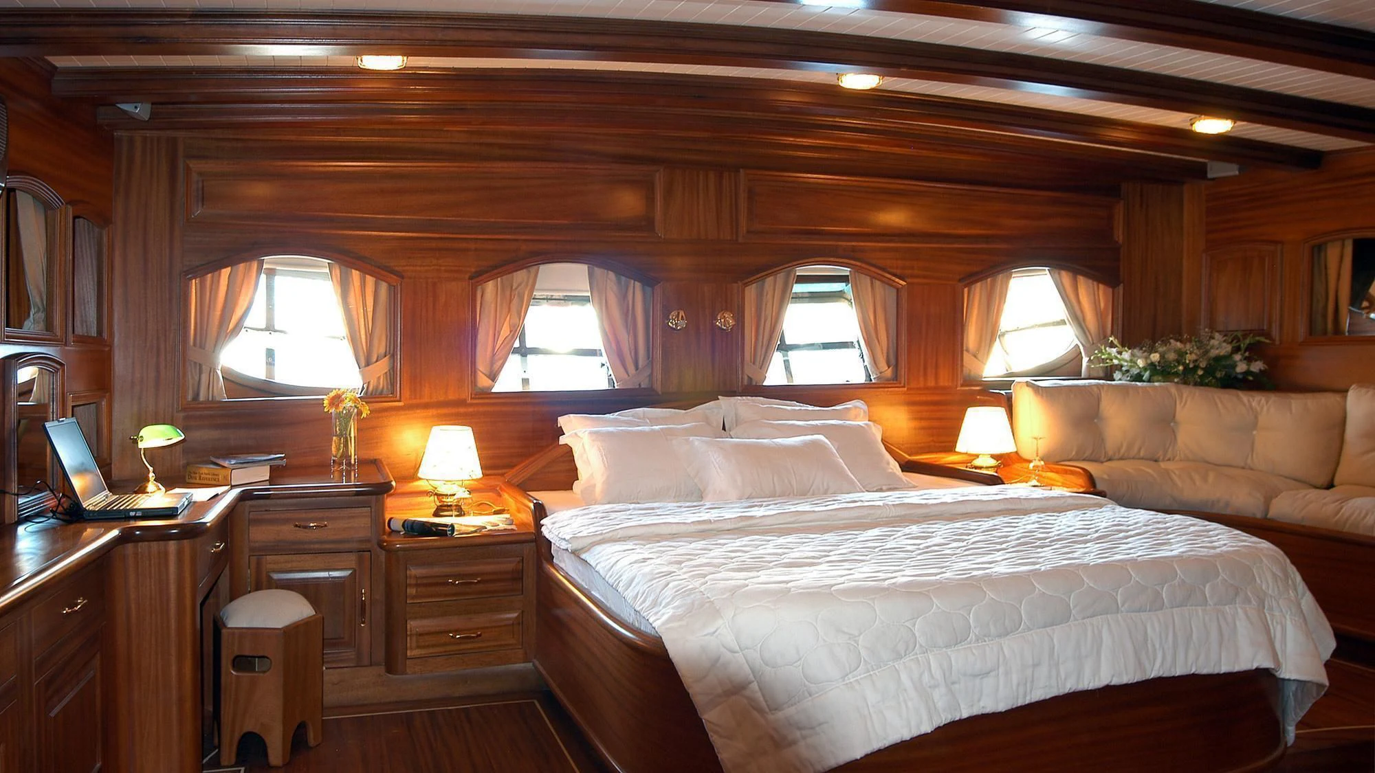 a bedroom with a bed and a couch aboard QUEEN OF KARIA Yacht for Sale