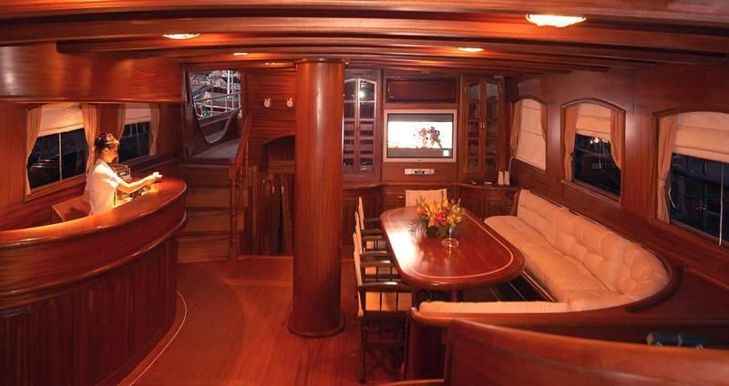 a room with a table and chairs aboard QUEEN OF KARIA Yacht for Sale