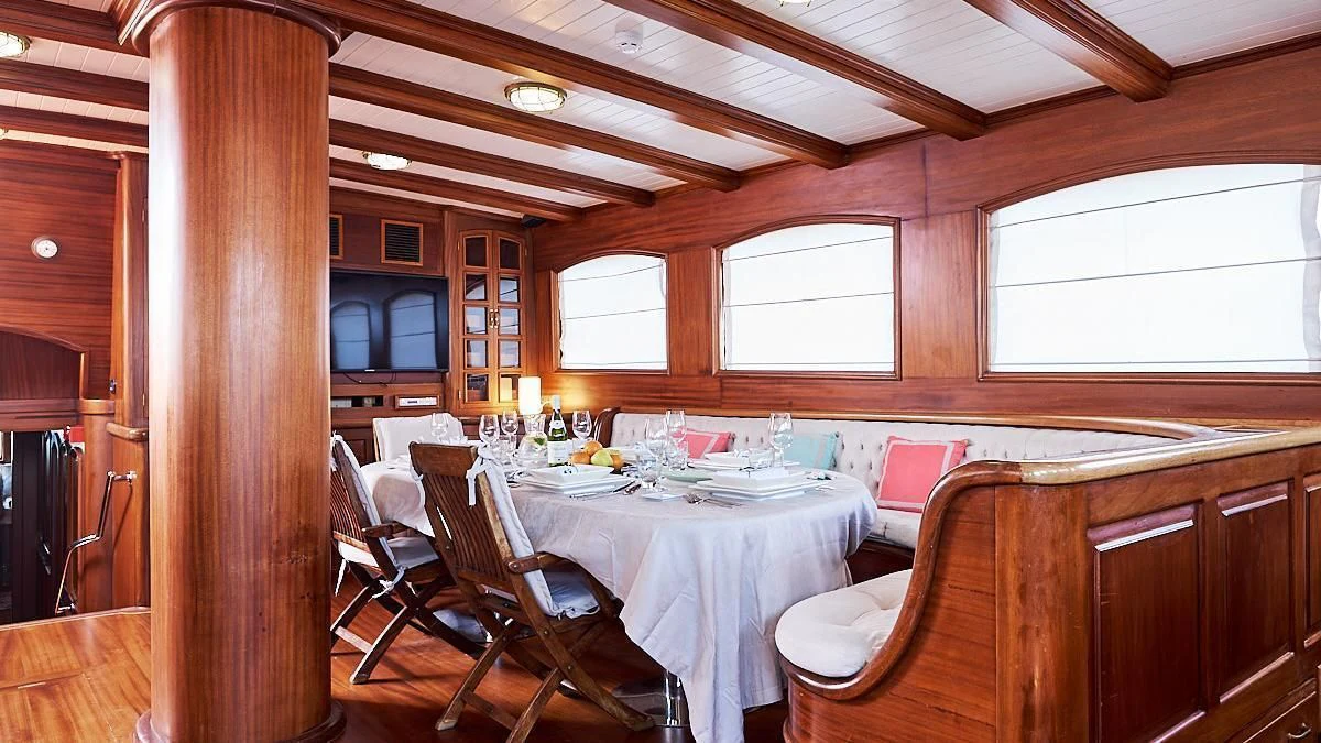 a dining table in a cabin aboard QUEEN OF KARIA Yacht for Sale