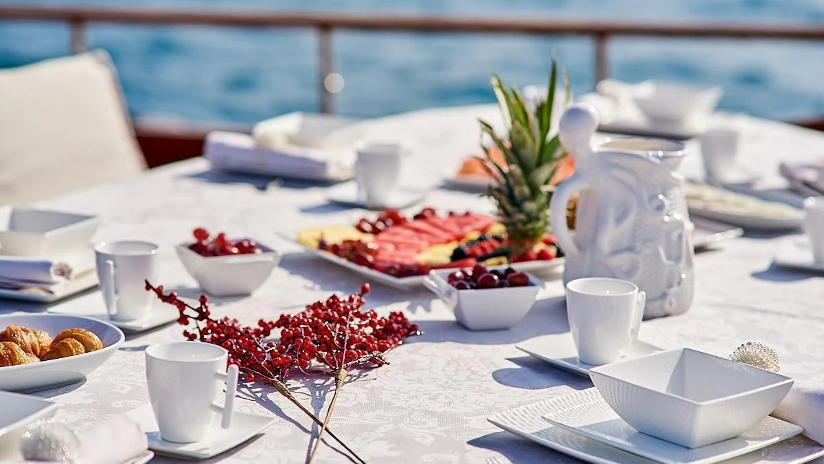 a table with food and drinks aboard QUEEN OF KARIA Yacht for Sale