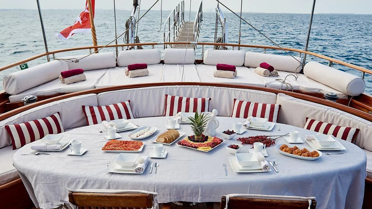a table set for a meal on a boat aboard QUEEN OF KARIA Yacht for Sale