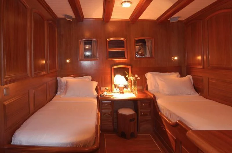 a room with two beds aboard QUEEN OF KARIA Yacht for Sale