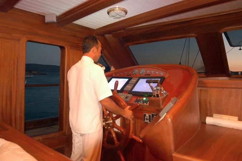 a person standing next to a machine aboard QUEEN OF KARIA Yacht for Sale