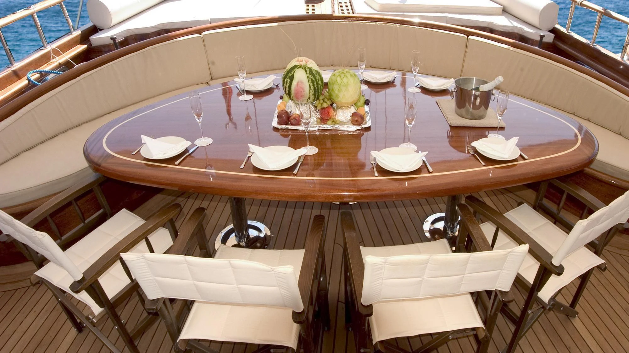 a table with plates and food on it aboard QUEEN OF KARIA Yacht for Sale
