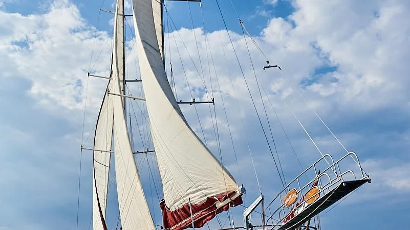 a plane flying over a sailboat aboard QUEEN OF KARIA Yacht for Sale