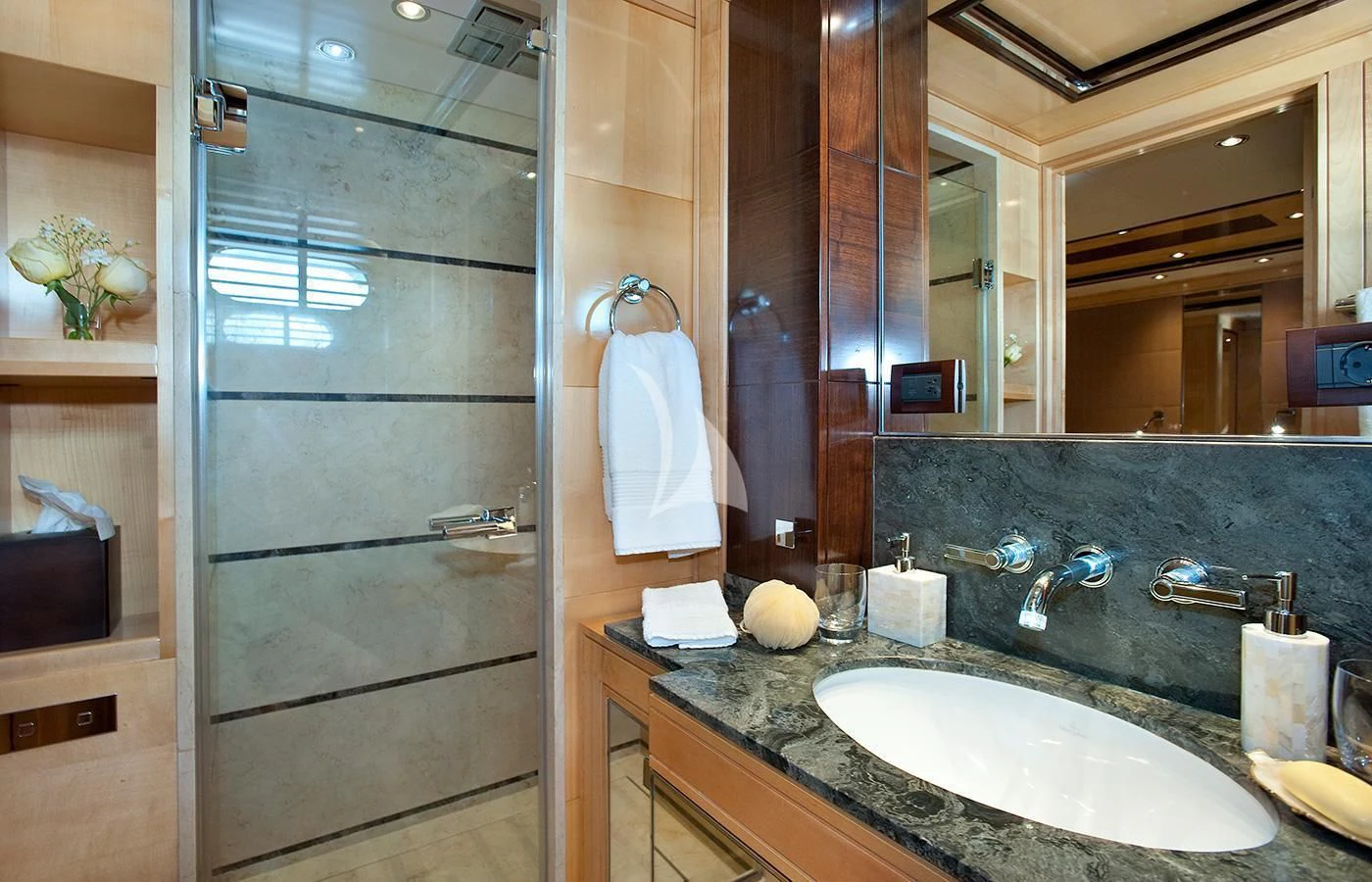 a bathroom with a glass shower door aboard CHRISTINA G Yacht for Charter