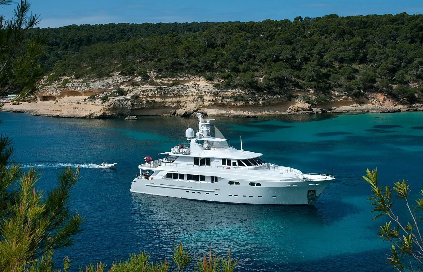 a white yacht in the water aboard CHRISTINA G Yacht for Charter