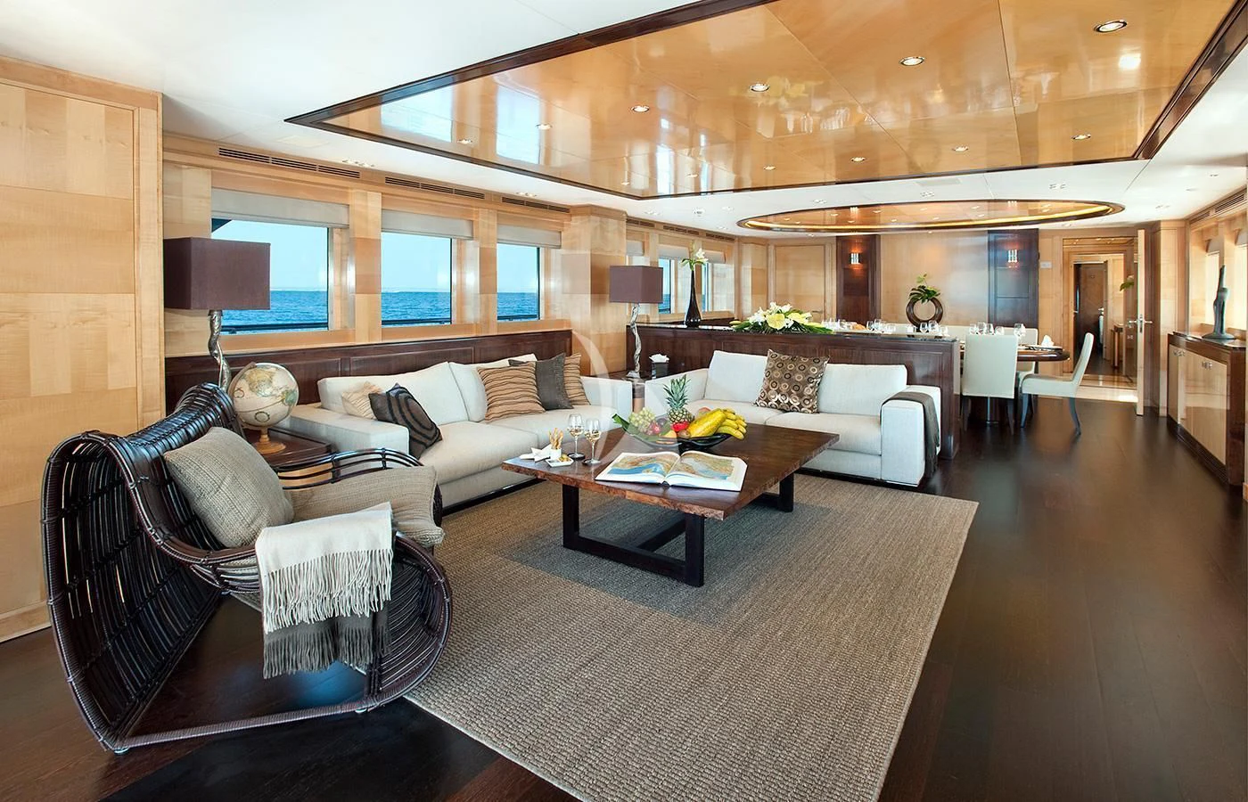 a living room with a couch and a coffee table aboard CHRISTINA G Yacht for Charter