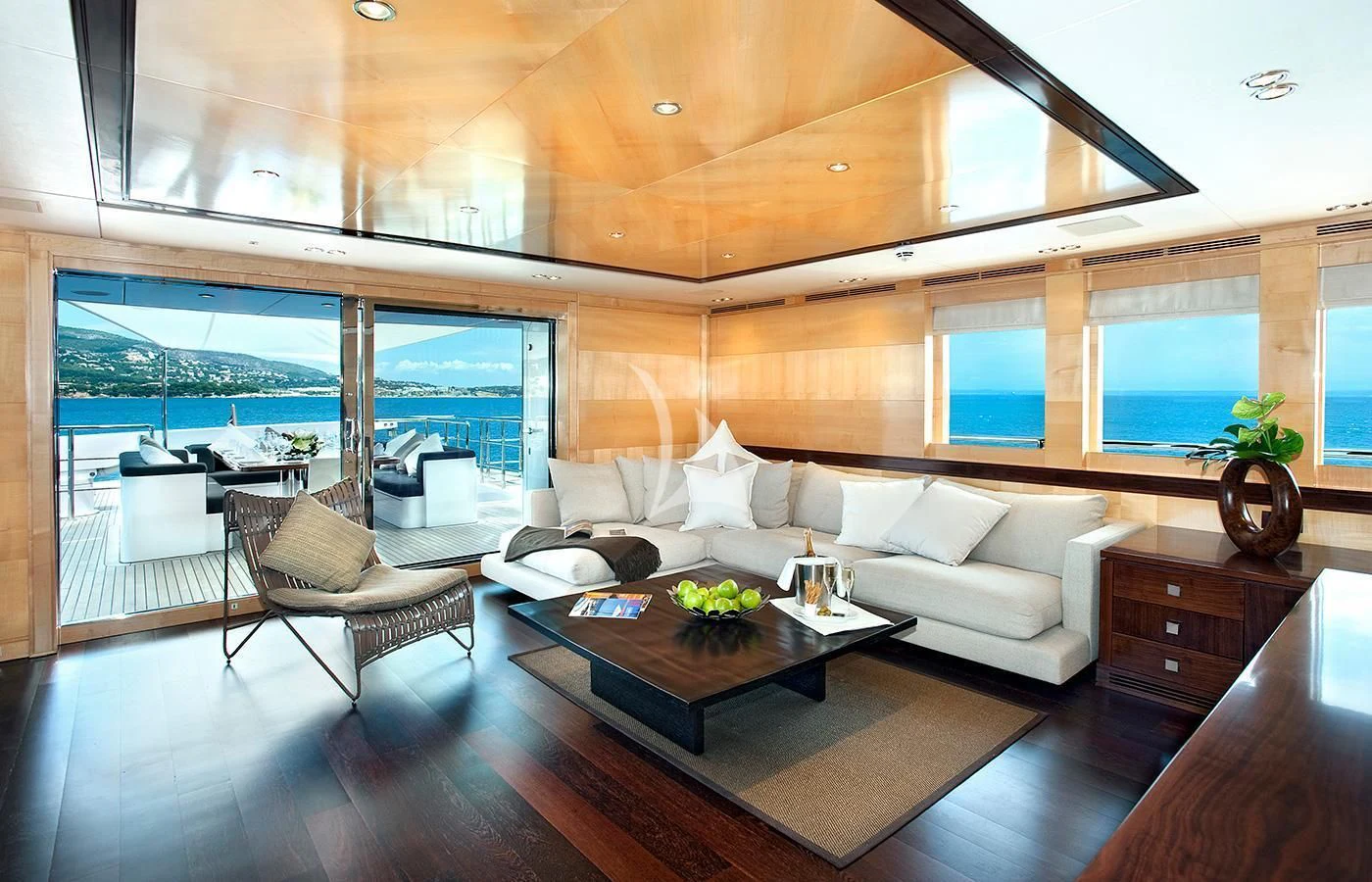 a living room with a large window aboard CHRISTINA G Yacht for Charter