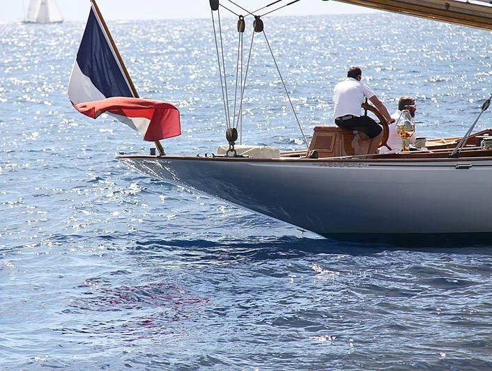 a couple of people sailing on a boat aboard MOONBEAM OF FIFE III Yacht for Sale