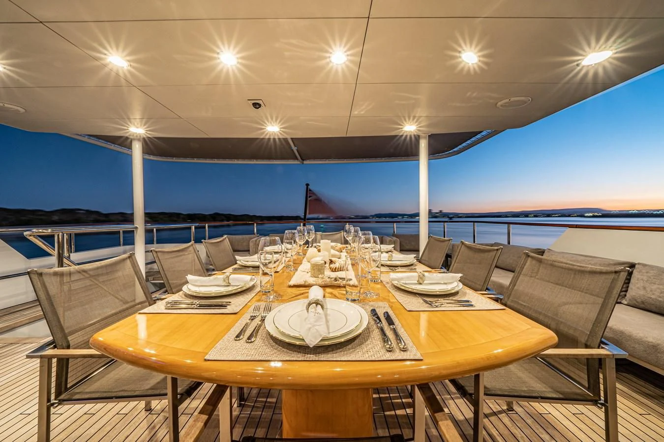 a table set for a dinner party aboard RELENTLESS Yacht for Sale