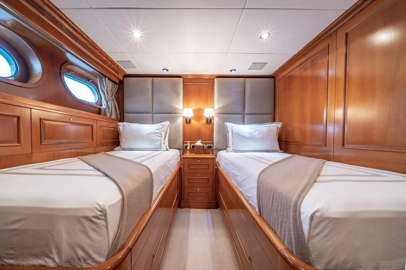 a room with two beds aboard RELENTLESS Yacht for Sale