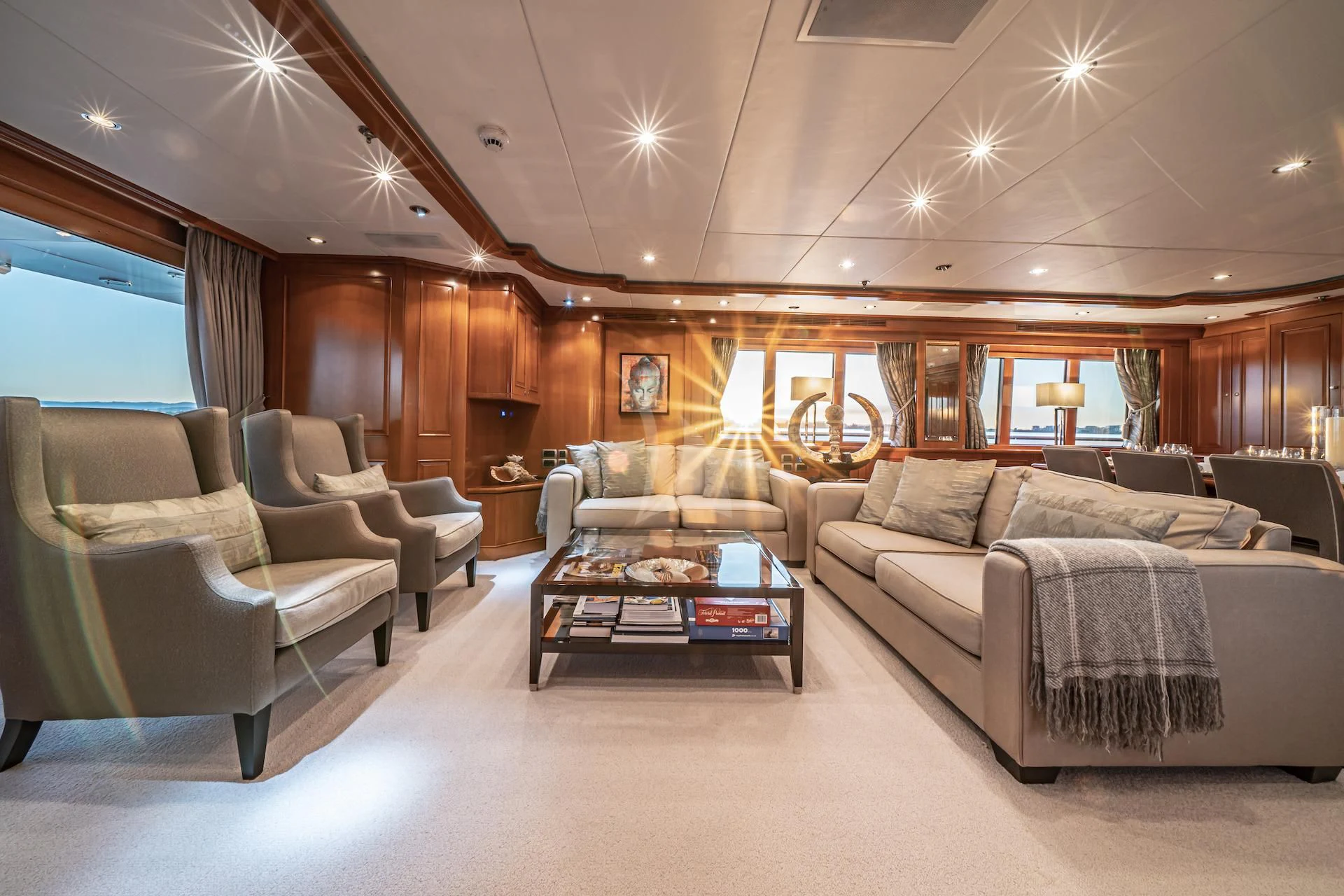 a living room with couches and a coffee table aboard RELENTLESS Yacht for Sale