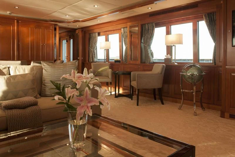 a living room with a vase of flowers on a table aboard RELENTLESS Yacht for Sale