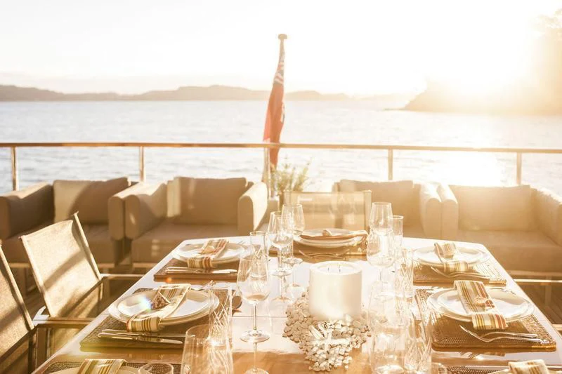 a table set for a dinner aboard RELENTLESS Yacht for Sale
