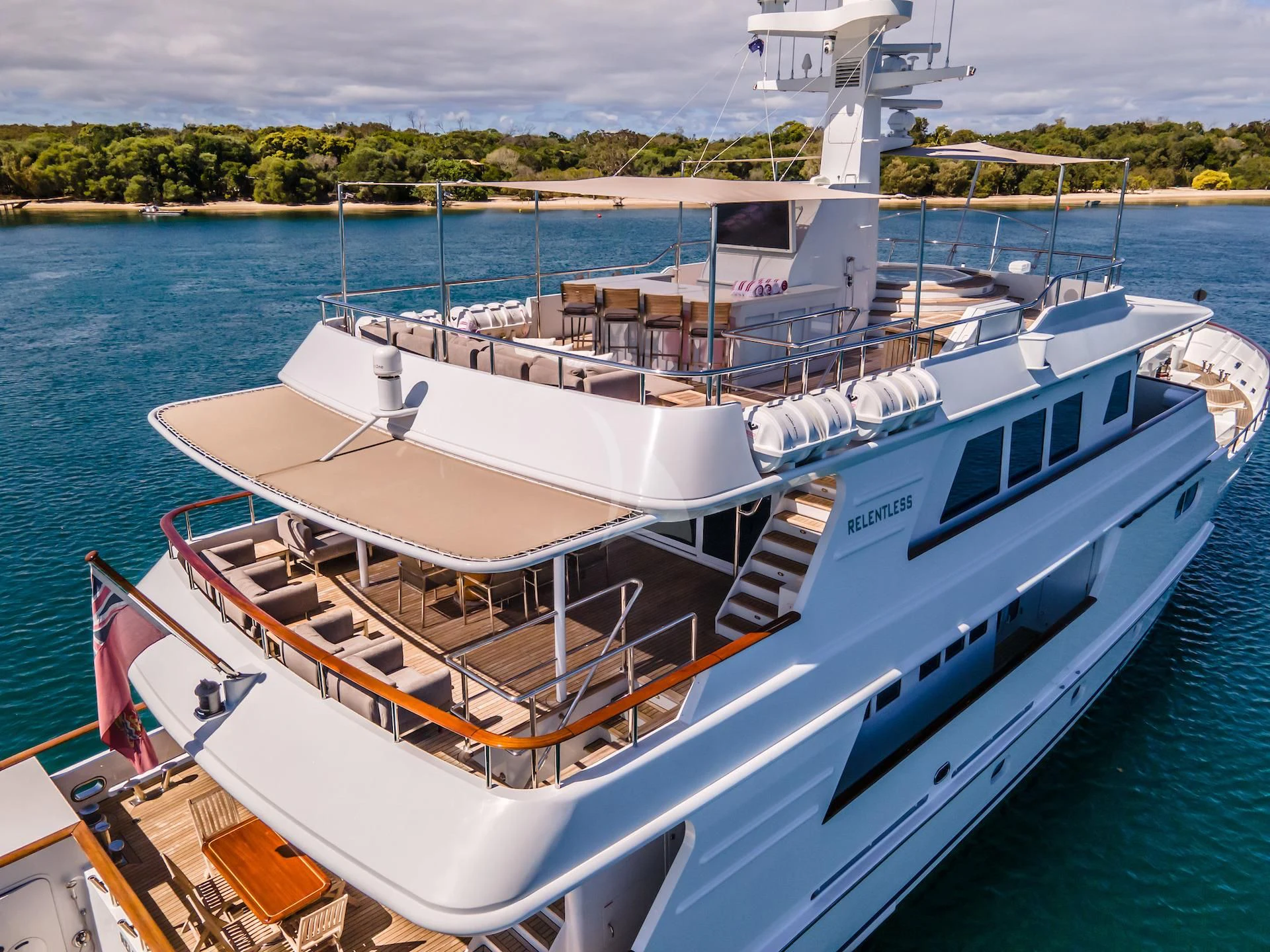 a large white boat docked aboard RELENTLESS Yacht for Sale